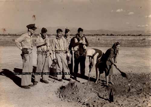 John Wall, 32 sqn 2nd on right, local women repair Araxos runway 1944